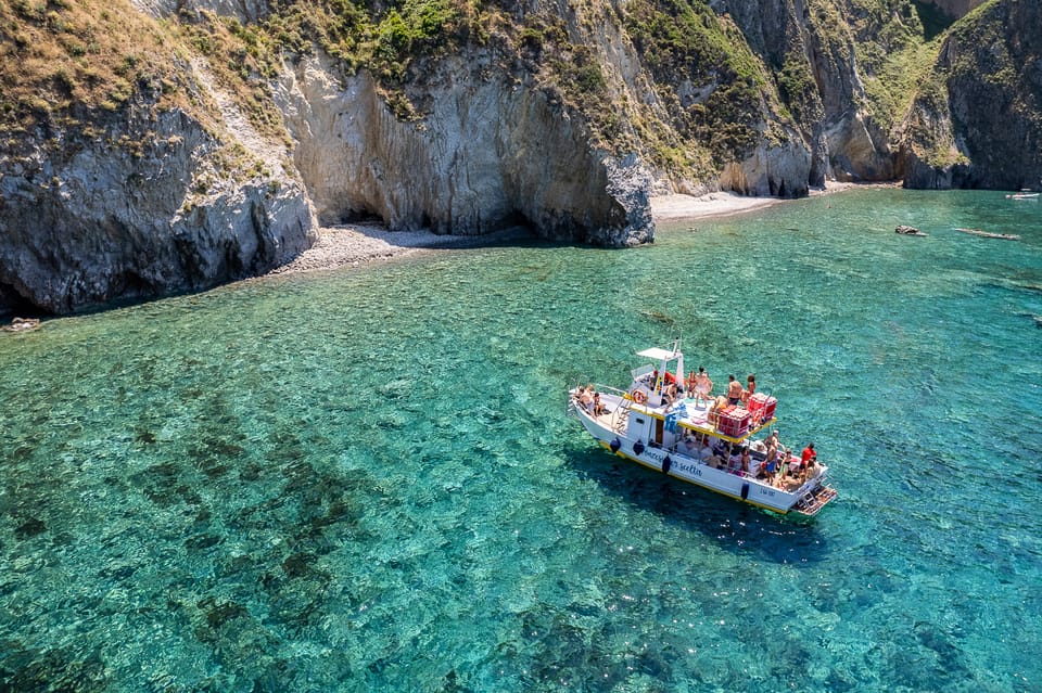 Crystal clear turquoise waters surrounding Ponza island with dramatic rock formations