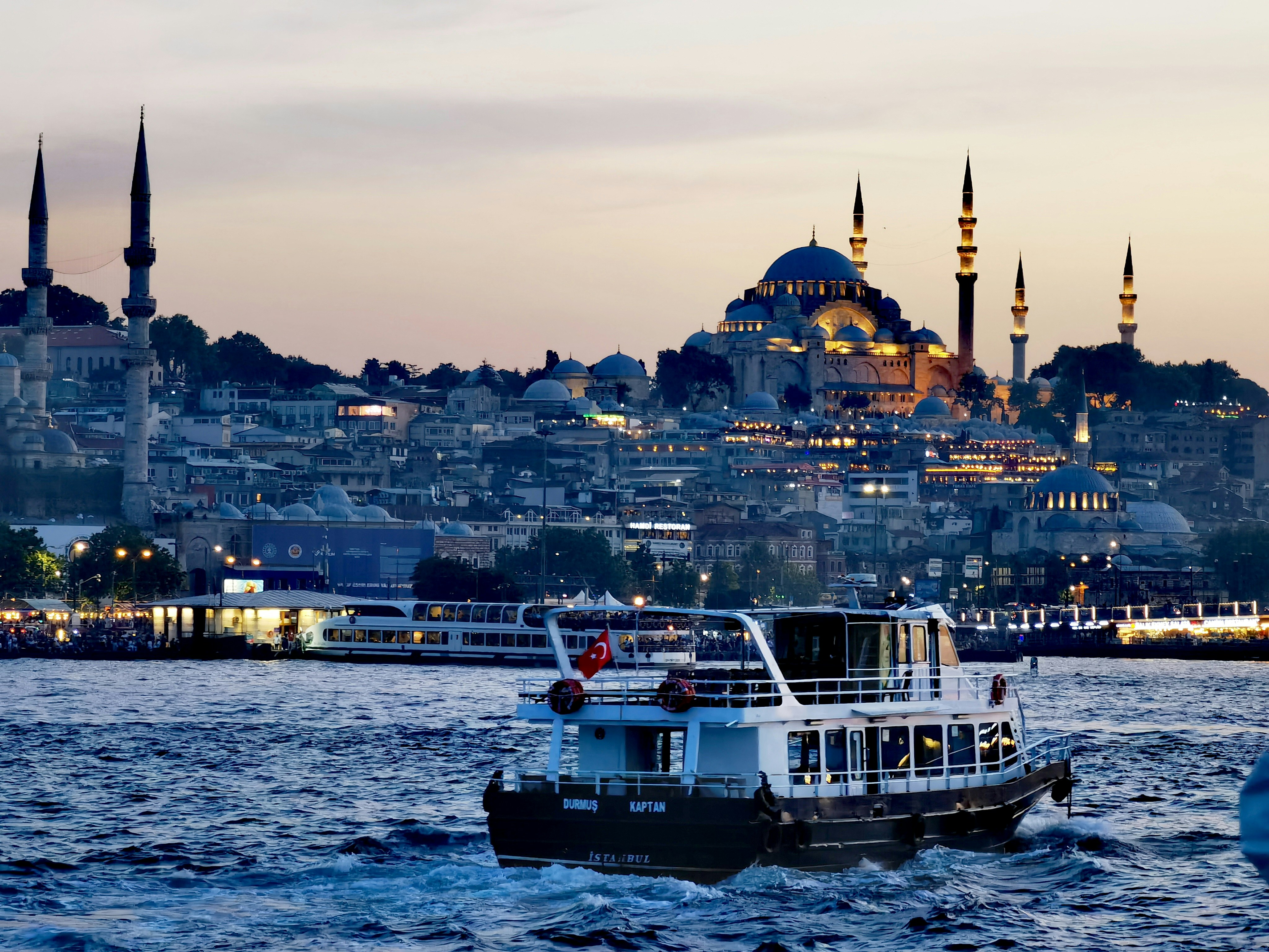 Ferry on the Bosphorus with the illuminated Blue Mosque in the background