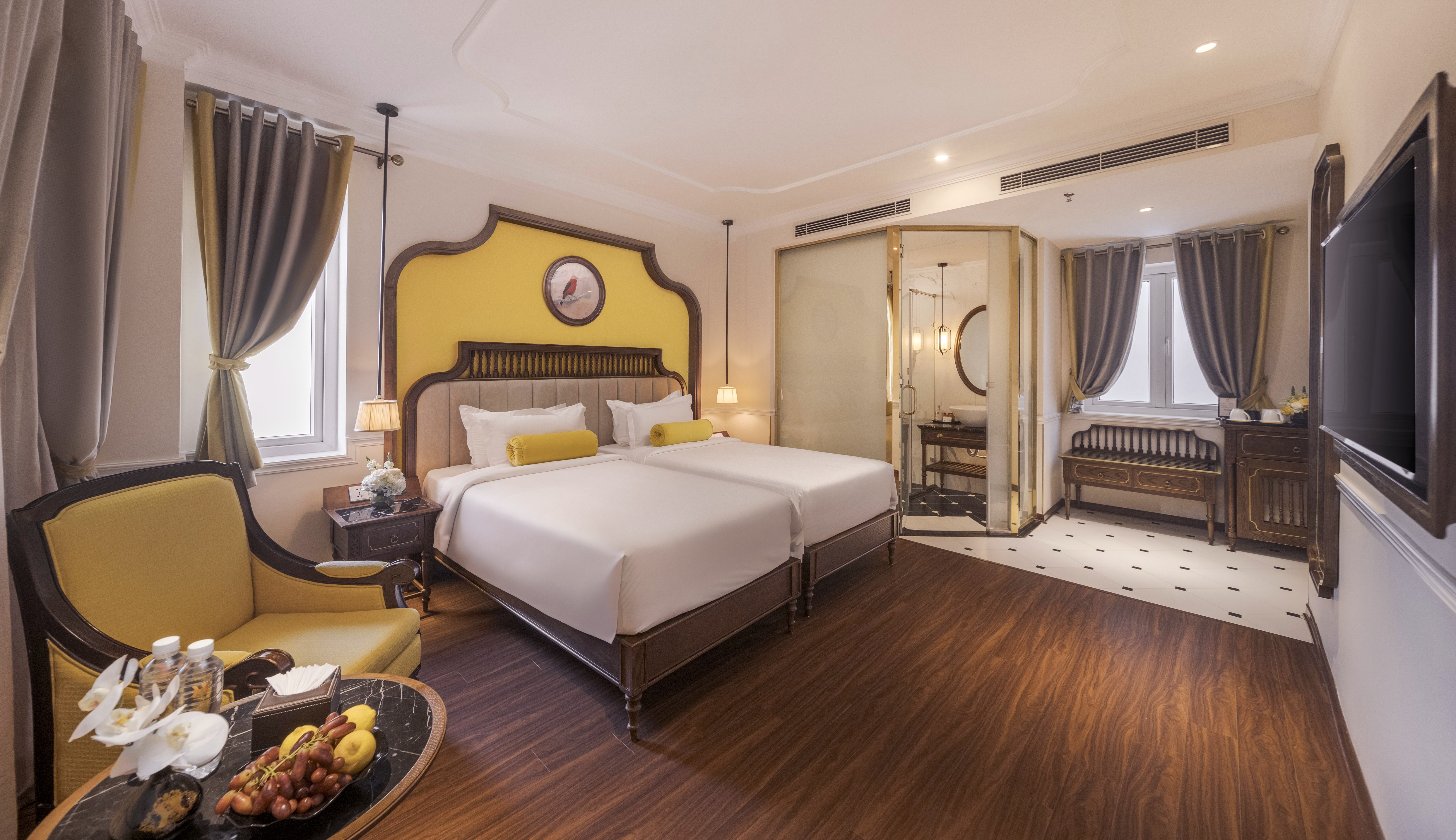 Luxury hotel room with yellow accents